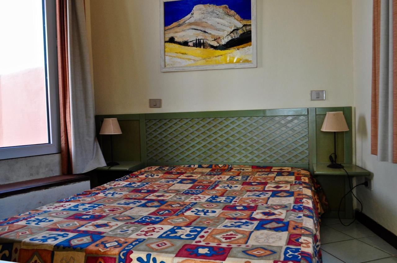 Rocciarossa Apartment Isola Rossa Bagian luar foto