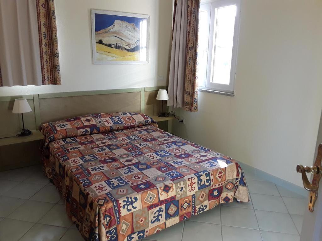 Rocciarossa Apartment Isola Rossa Bagian luar foto