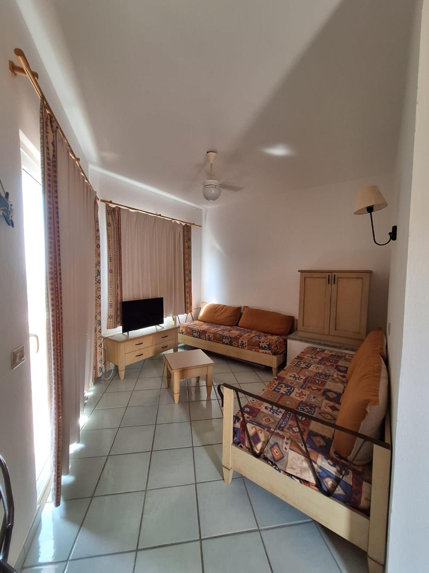 Rocciarossa Apartment Isola Rossa Bagian luar foto